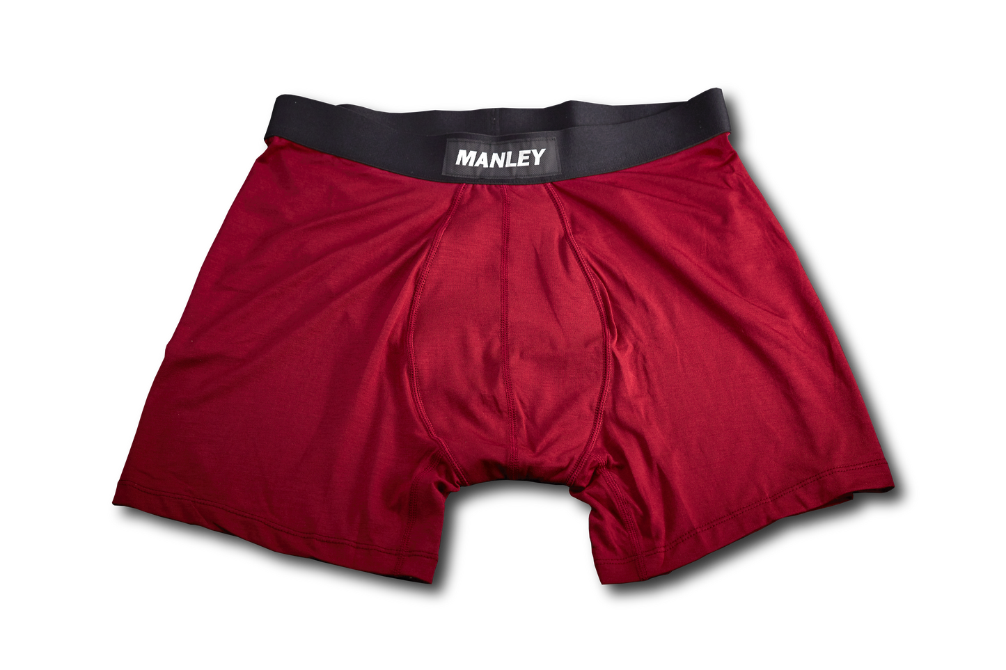 Red Manley boxer briefs lying flat. Shows the Manley logo on the waistband. 