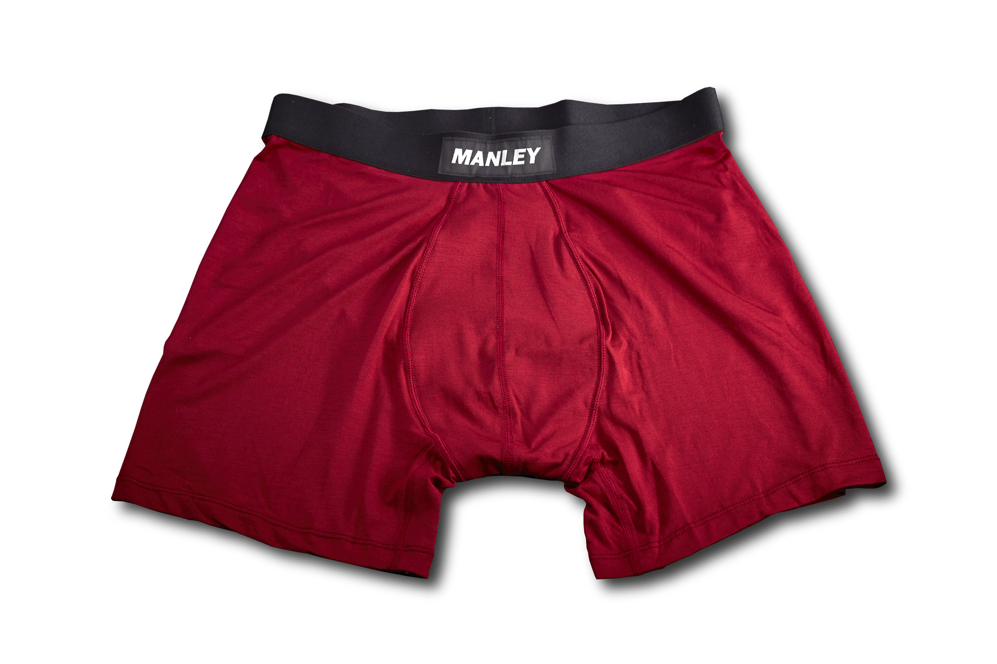 Red Manley boxer briefs lying flat. Shows the Manley logo on the waistband. 